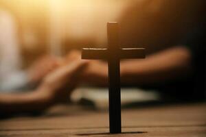 Christian group are praying to god with the bible and sharing the gospel. Concept of faith for god. photo