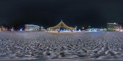 night full 360 panorama on square with Christmas tree with illumination in form of tent on new Year in equirectangular projection with zenith. VR AR content photo