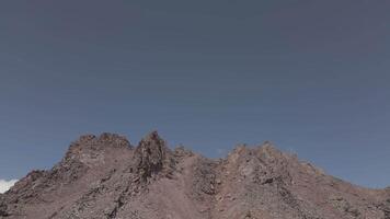 Aerial rising ascending view caucasus mountains range with colorful valleys on alpine zone. Kazbek mountain peak in background video