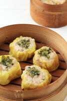 Dimsum Dim Sum, Chinese Snack Meal made from Chicken, Fish, or Shrimp Meat Covered with Dimsum Skin photo