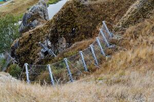 Dividing the boundaries of the territory, a live fence, a protective structure with an electric current. photo
