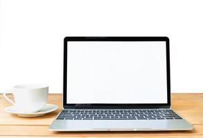 Front view of laptop mockup and coffee cup on white photo