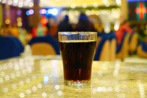 Close up of cold drink on the table with boken lights portrait background photo