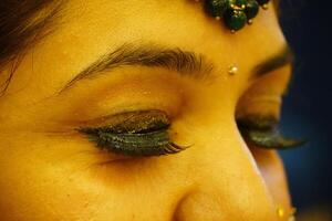 Beautiful woman with long eyelashes and with beautiful evening make-up. Eyes close-up image photo