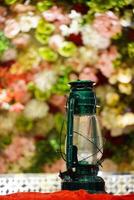Green lamp with Colorful flower background photo
