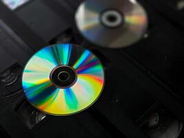 Retro revival. dvds and vhs tapes highlight the evolution of media formats photo