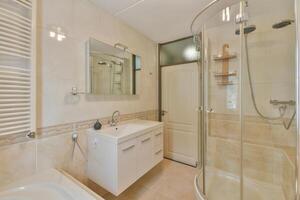 A bathroom with a shower and a sink photo