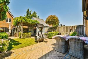 A patio with a table and chairs photo