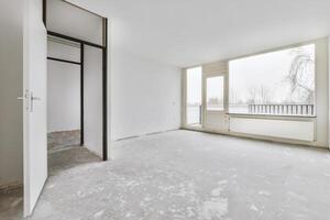 Empty room with white walls and a door photo