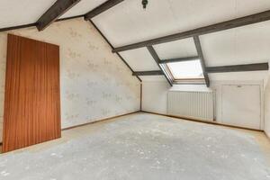 A room with a wooden door and a window photo