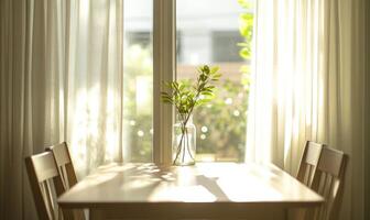 Bright minimalist dining area, small window with sheer curtains photo