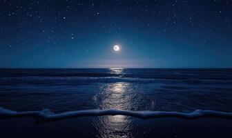 Bright moon casting a long reflection on the ocean photo