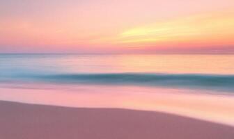 A beautiful beach with a pink and orange sunset in the background photo
