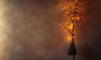Witch's broom adorned with glowing garlands photo