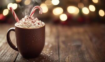 A mug of hot chocolate with whipped cream and two candy cane stirrers photo