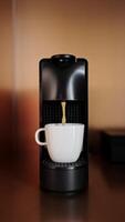 Close-up making morning espresso using capsule coffee machine for home use. Start you day with boost energizing caffeine beverage. People. Food and drink. Vertical shot video
