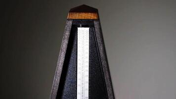 Close-up Shot Of Mechanical Metronome Arm Moving Back And Forth At Presto Tempo video