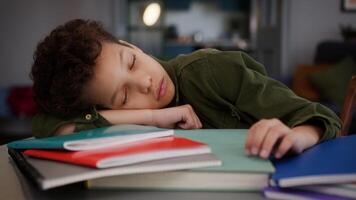 Tired sleeping napping exhausted ill sick unwell fatigued African American son kid child boy pupil student schoolboy at home sleep studying learning study learn health problem insomnia lazy overworked video
