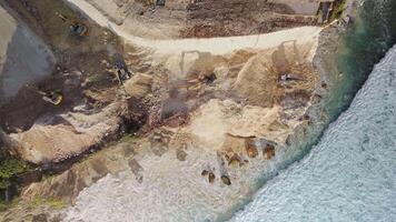 The work of escalators and the destroying of the rock in Bali. Aerial view video