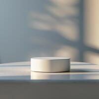 A white object sitting on a table in front of a window photo