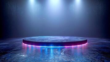 A stage with a round table in the middle of a dark room photo
