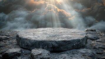A stone slab on top of a rocky hill with clouds in the background photo