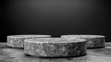 Three marble round tables on a concrete floor photo