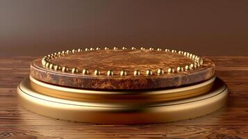A golden round table with a wooden base and a metal top photo