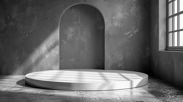 A white round platform in a room with a window photo