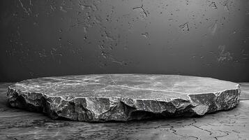 A black and white photo of a stone table