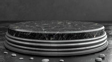 A black marble pedestal with a stone base photo