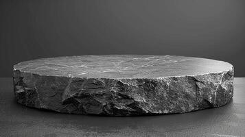 A large black stone table on a table photo
