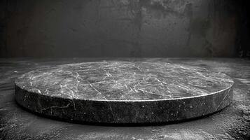 A black marble table with a circular top photo