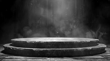Black and white photo of a stage with a spotlight