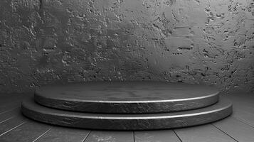 A black and white photo of a round podium on a wooden floor