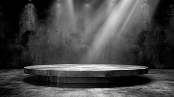 Black and white photo of a stage with spotlight