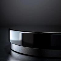 A black and silver circular object on a table photo