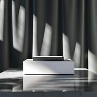 A white box sitting on a table in front of curtains photo