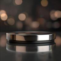 A silver object on a table with a blurred background photo
