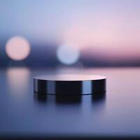 A black object sitting on a table in front of a blurred background photo