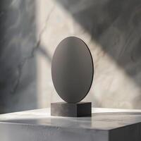 A black round object on a white table photo
