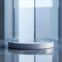 A white circular table with a glass top photo