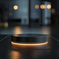 A black circular object on a table in front of a dark background photo