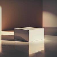 A white cube sitting on a table in front of a wall photo
