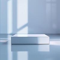A white box sitting on a floor in front of a window photo