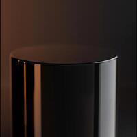 A black cylinder on a table with a light photo
