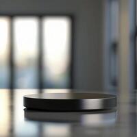 A black object on a table in front of a window photo
