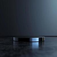 A black object on a table with a dark background photo