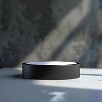 A black circular object sitting on a table photo
