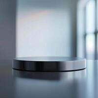 A black circular object on a table in front of a window photo